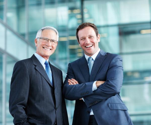 Two businessmen smiling
