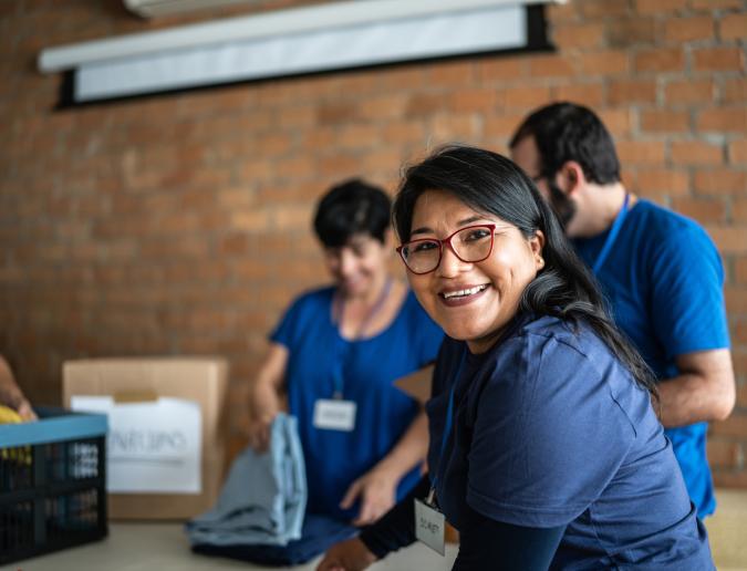 Volunteer working in a community charity donation center